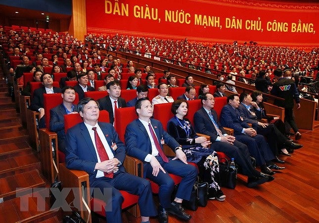 Đại biểu dự phiên thảo luận các văn kiện đại hội tại hội trường, sáng 28/1. (Ảnh: TTXVN)