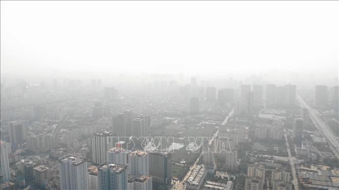 Hầu hết chỉ số chất lượng không khí ở Bắc Bộ đều ở mức màu đỏ, có hại cho sức khỏe. Ảnh tư liệu: TTXVN