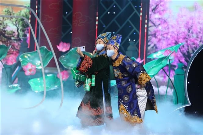 Nhiều quy định phòng, chống dịch COVID-19 được đưa vào Táo quân 2022 (Ảnh: TTXVN)